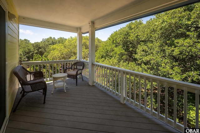 wooden terrace with a forest view