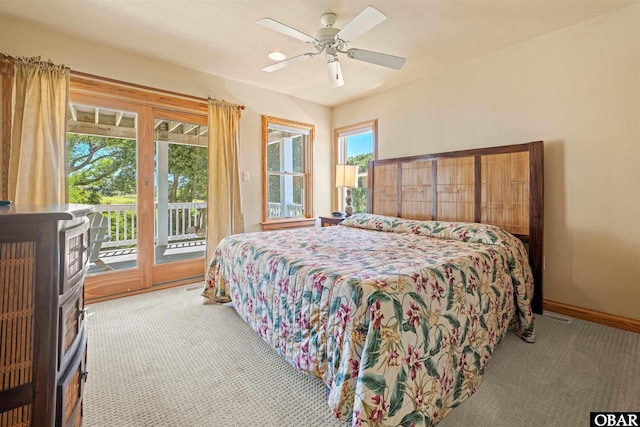 bedroom featuring access to exterior, carpet, baseboards, and ceiling fan