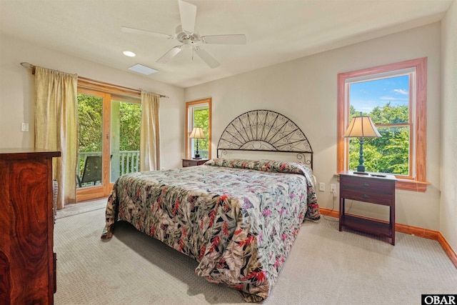 bedroom with access to exterior, ceiling fan, carpet, and baseboards