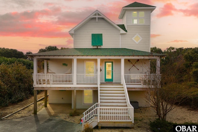 119 Olde Duck Rd Lot # 11, Duck, NC 27949 - coastal inspired home featuring a porch, stairway, a shingled roof, concrete driveway, and a carport
