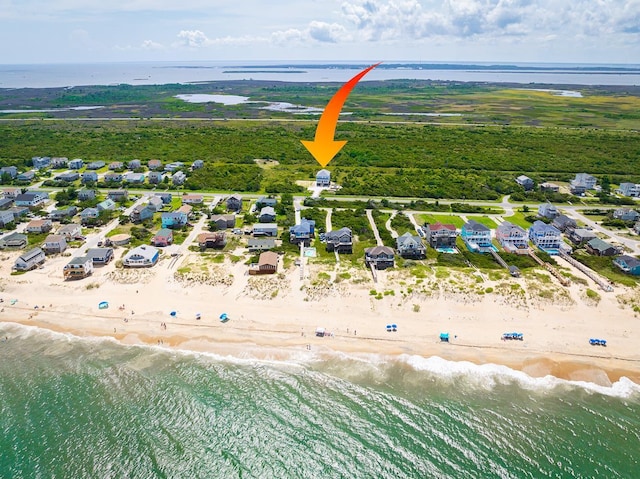 aerial view with a water view and a view of the beach