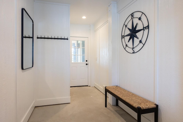 doorway with recessed lighting and concrete floors