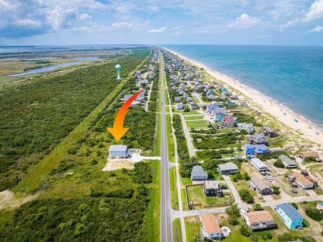 aerial view featuring a view of the beach and a water view