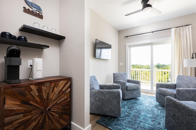 interior space with ceiling fan and wood finished floors