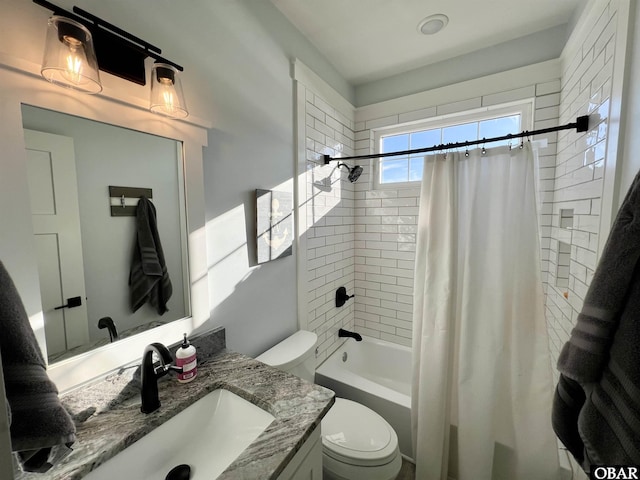 full bathroom featuring shower / bathtub combination with curtain, toilet, and vanity