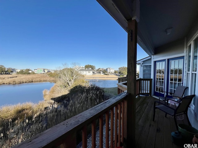 balcony featuring a water view