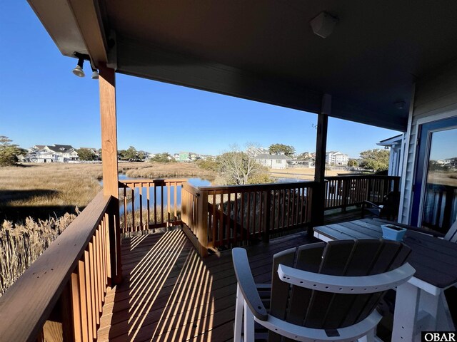 deck featuring a water view