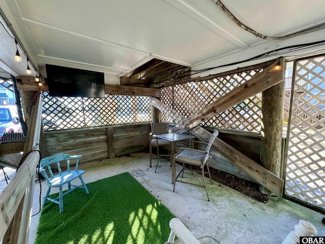 view of patio featuring fence