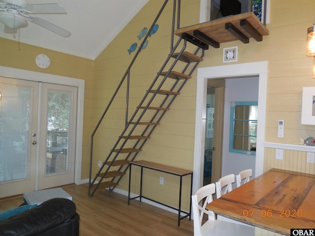 104 Sand Dollar Rd Lot # 23, Ocracoke, NC 27960 - living room with lofted ceiling, wood finished floors, a ceiling fan, stairs, and wood walls
