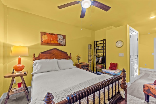 bedroom featuring ceiling fan, carpet, and baseboards