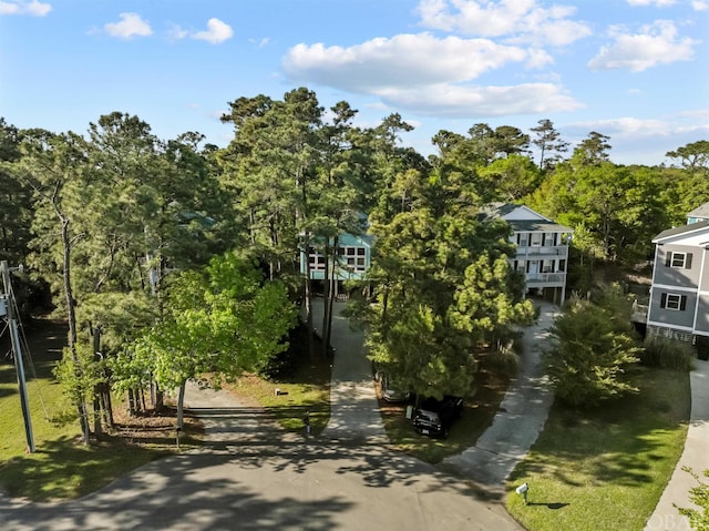 view of community featuring concrete driveway