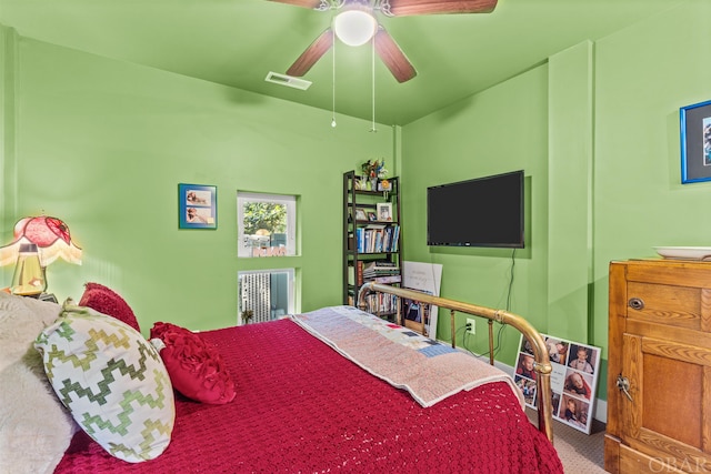 bedroom with ceiling fan, carpet flooring, and visible vents