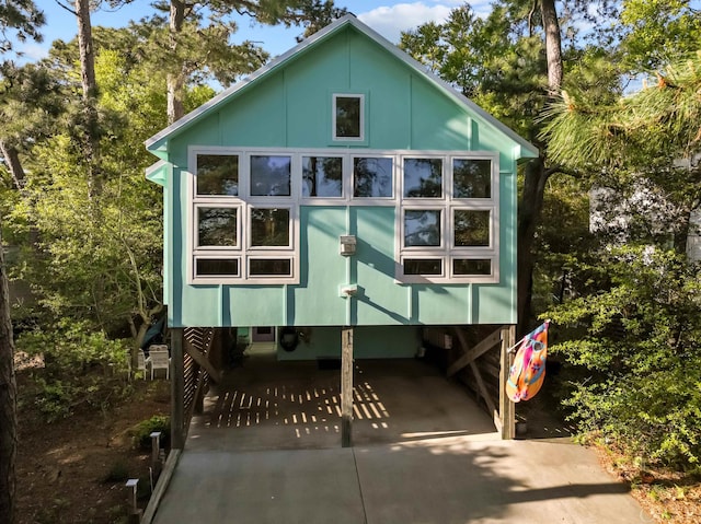 exterior space with a carport and concrete driveway