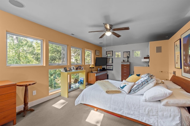 bedroom featuring light carpet, visible vents, and baseboards