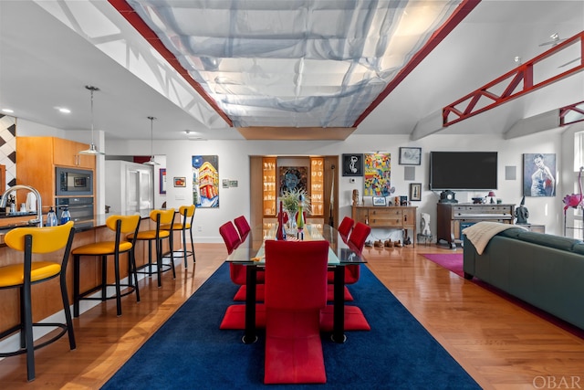 dining space featuring light wood-style floors