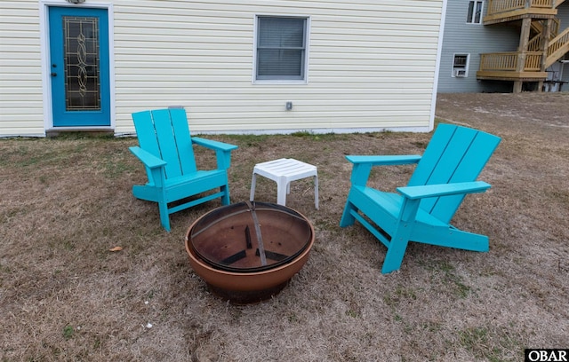 view of patio with a fire pit