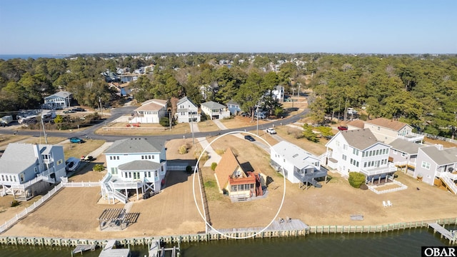 birds eye view of property featuring a residential view and a water view