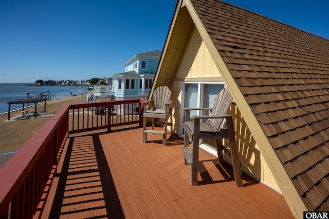 wooden deck with a water view