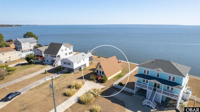 bird's eye view featuring a residential view and a water view