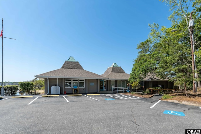 view of building exterior featuring uncovered parking