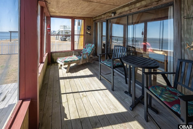 sunroom with a water view