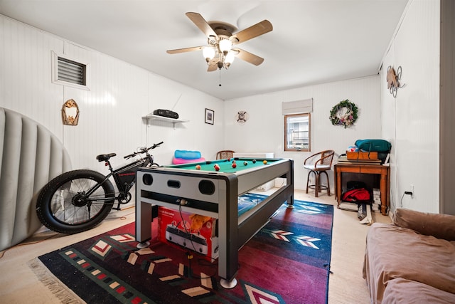 game room with a ceiling fan