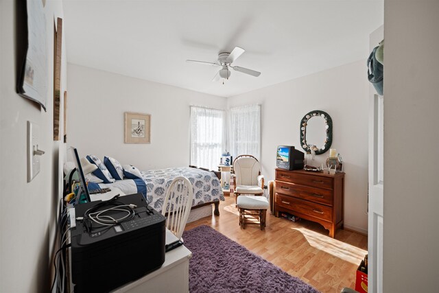 bedroom with ceiling fan and wood finished floors