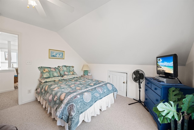 bedroom with lofted ceiling, baseboards, carpet floors, and a ceiling fan