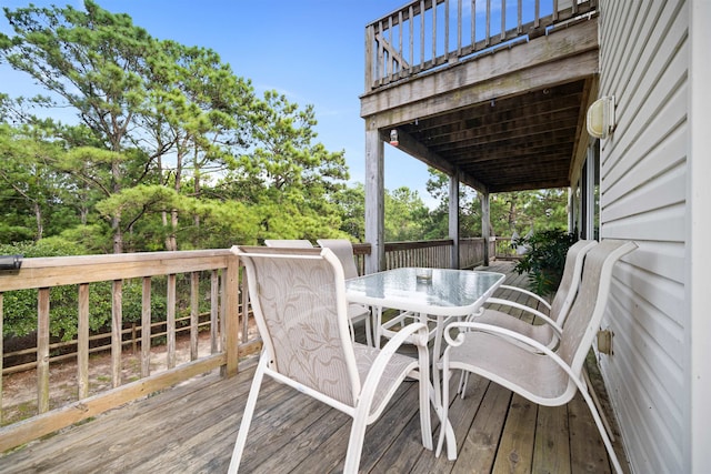 wooden deck with outdoor dining area