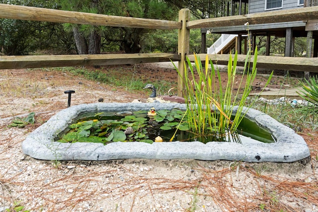 exterior details with a small pond