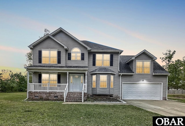 traditional-style home featuring crawl space, driveway, covered porch, an attached garage, and a front yard