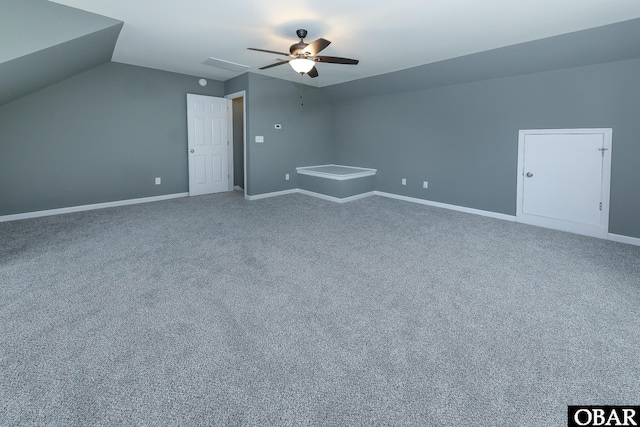 bonus room featuring baseboards, lofted ceiling, a ceiling fan, and carpet