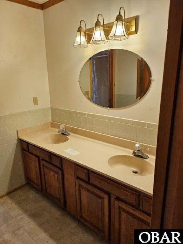 7013 Currituck Rd Lot 4, Kitty Hawk, NC 27949 - full bath featuring tile walls, double vanity, tile patterned flooring, and a wainscoted wall