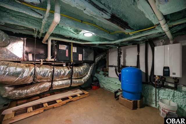 unfinished below grade area featuring tankless water heater