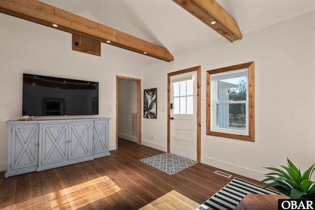 unfurnished living room with lofted ceiling with beams, visible vents, baseboards, and dark wood-style flooring