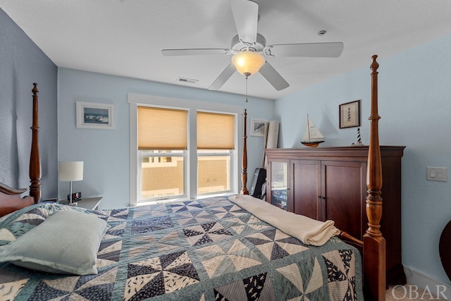 bedroom with visible vents and a ceiling fan