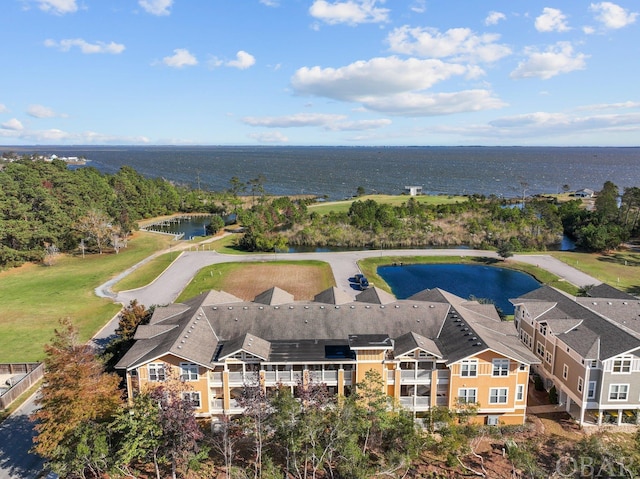 birds eye view of property with a water view