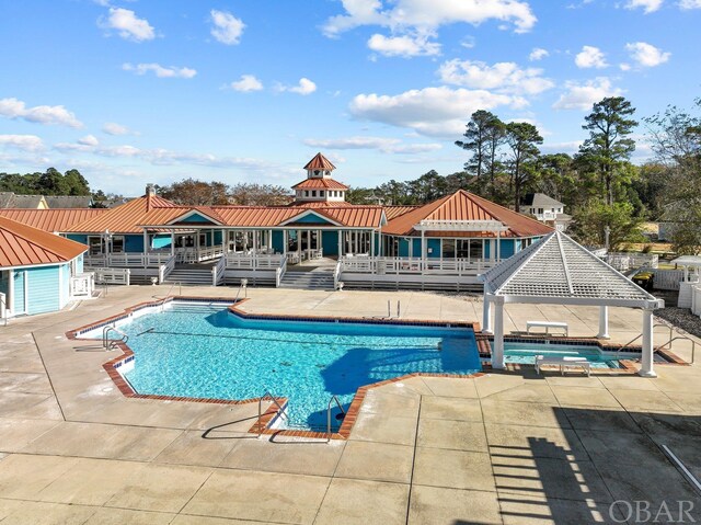 pool with a gazebo, a patio area, and a jacuzzi