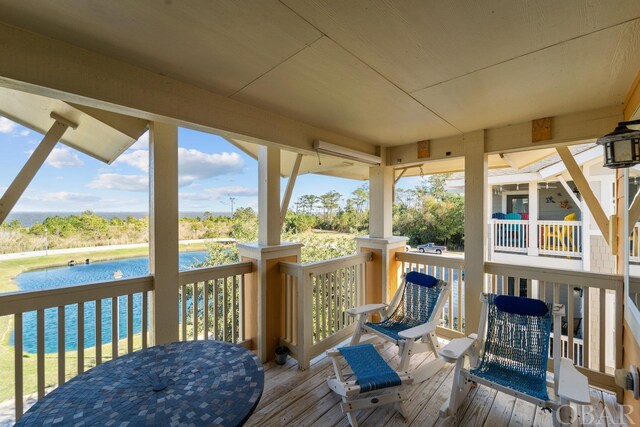 deck featuring a water view