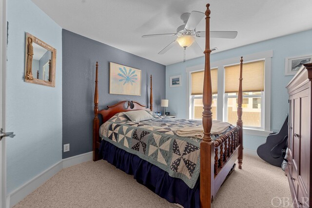 bedroom with baseboards, a ceiling fan, and light colored carpet