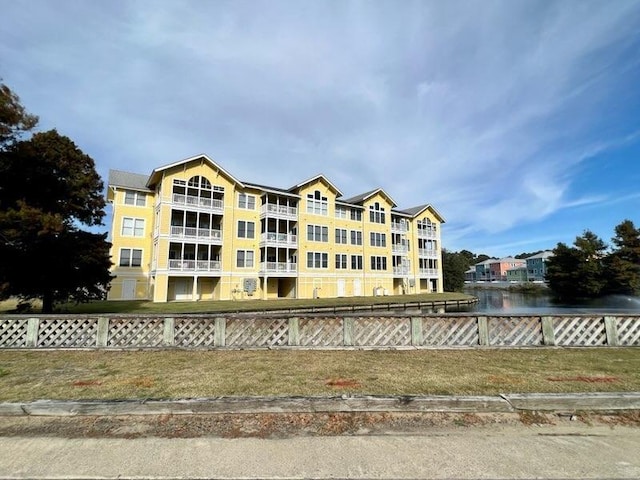 view of building exterior featuring fence