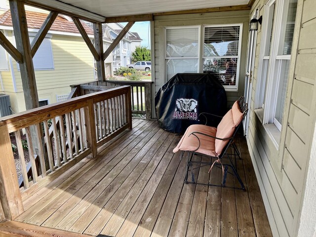 wooden deck featuring area for grilling