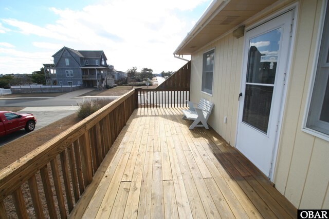 wooden deck with a residential view