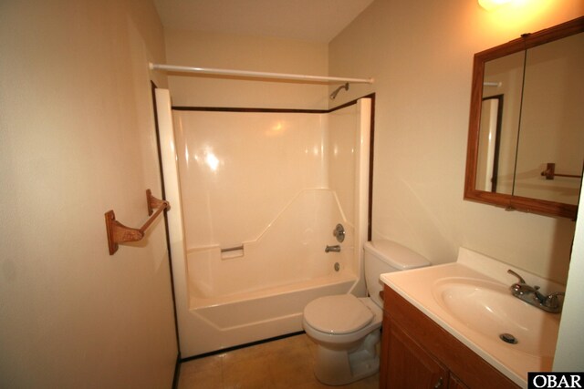 bathroom with toilet, shower / bathing tub combination, and vanity