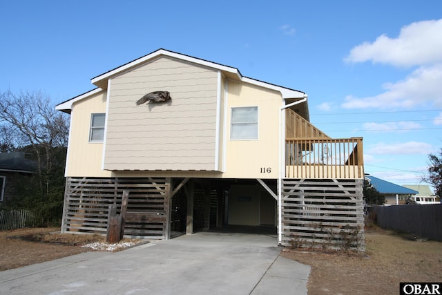 view of front of house featuring a carport and stairs