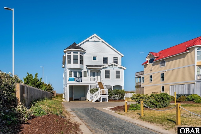 7239 S Old Oregon Inlet Rd Lot 1, Nags Head, NC 27959 - view of front of home with a carport, stairs, and driveway