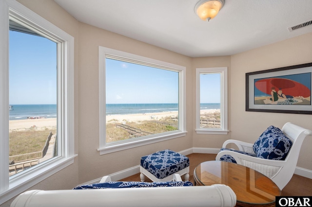 7239 S Old Oregon Inlet Rd Lot 1, Nags Head, NC 27959 - sitting room with baseboards, view of water and beach, and healthy amount of natural light