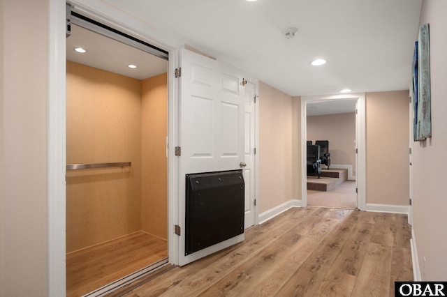 7239 S Old Oregon Inlet Rd Lot 1, Nags Head, NC 27959 - corridor with light wood-type flooring, elevator, recessed lighting, and baseboards