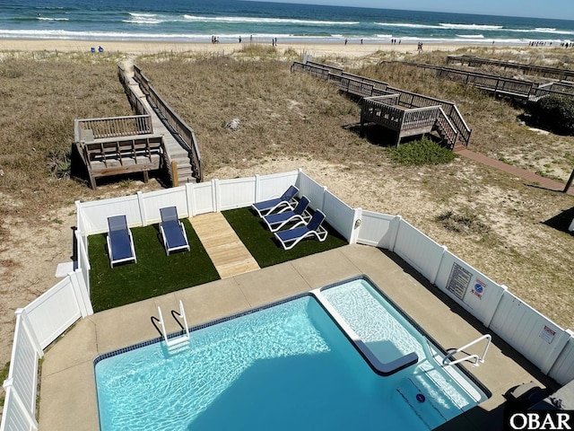 7239 S Old Oregon Inlet Rd Lot 1, Nags Head, NC 27959 - view of swimming pool with view of local beach, a fenced backyard, stairs, and a deck with water view