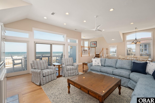 7239 S Old Oregon Inlet Rd Lot 1, Nags Head, NC 27959 - living area with light wood-style flooring, stairway, a water view, vaulted ceiling, and recessed lighting